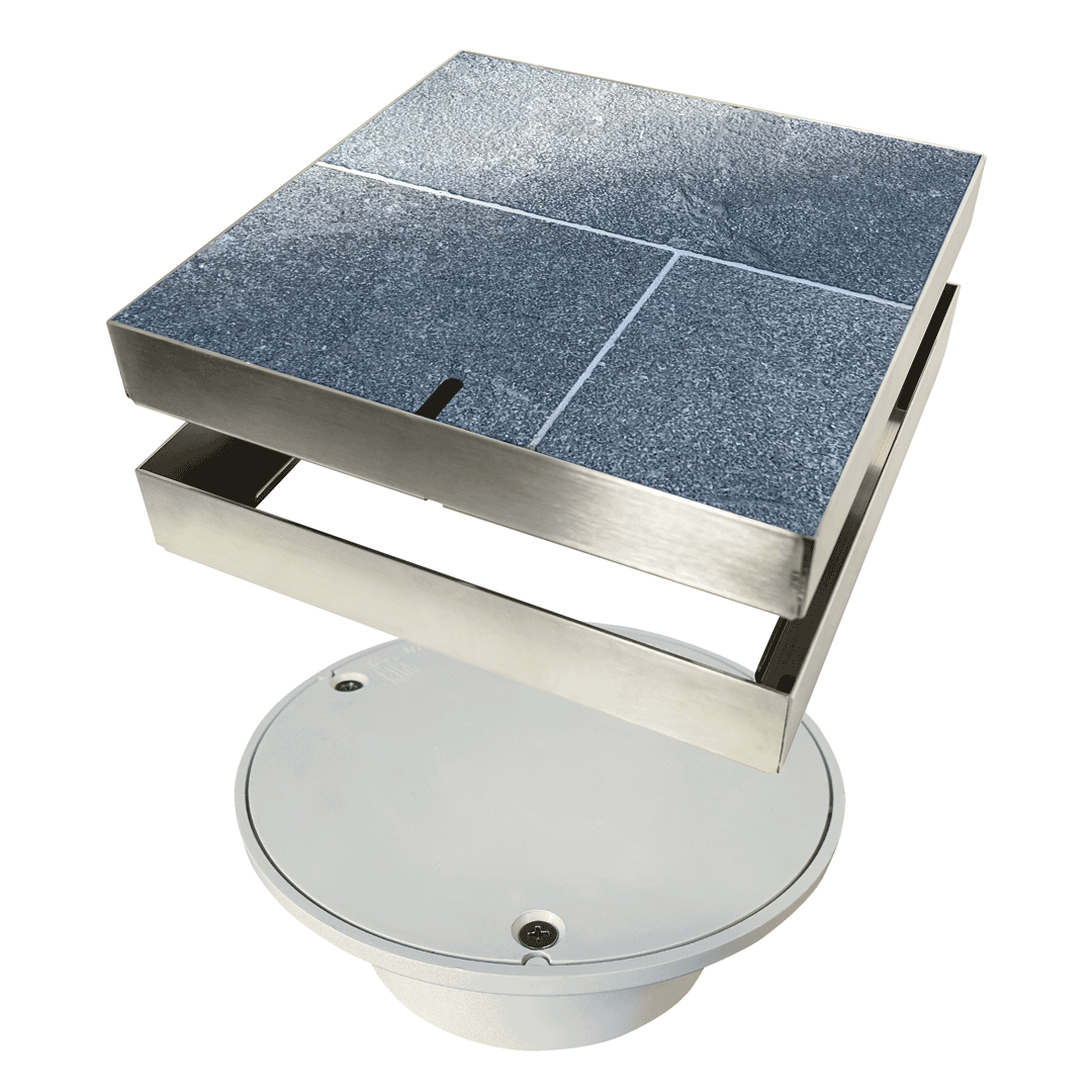 The HIDE Access Cover conceals unsightly plastic service points, such as this Bolted Trap Screw (BTS) cover commonly found in patios and other outdoor areas. It provides a sleek finish while maintaining easy access to this essential service point.