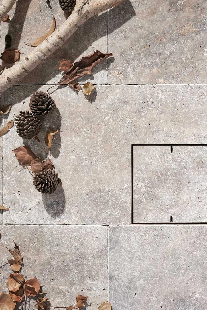 HIDE drain cover with natural stone infill and 2 slots for lifting