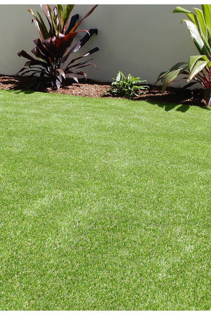AFTER image of well camouflaged HIDE drain cover using synthetic grass infill