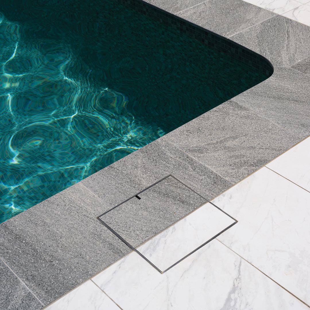 HIDE Skimmer Cover with coping and poolside tile infills to match