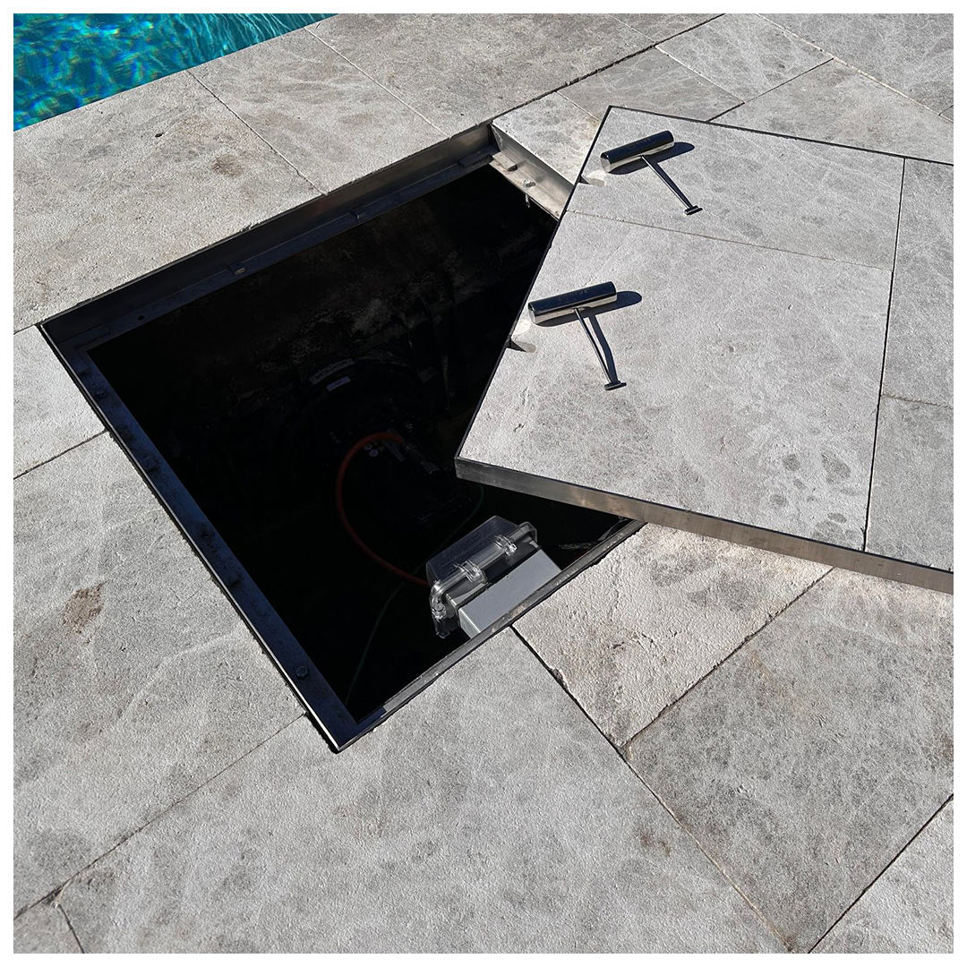 HIDE 656 mm Manhole Cover hiding a large pool pump