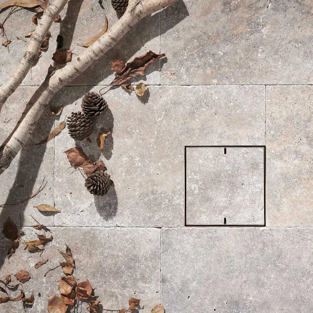 HIDE drain cover with  natural stone infill and 2 slots for lifting