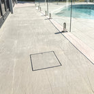 Poolside path with HIDE hatch cover